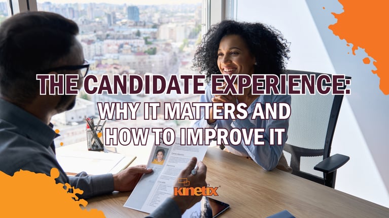 Recruiter reviews a candidate's resume during an in-person job interview in a bright, modern office. 