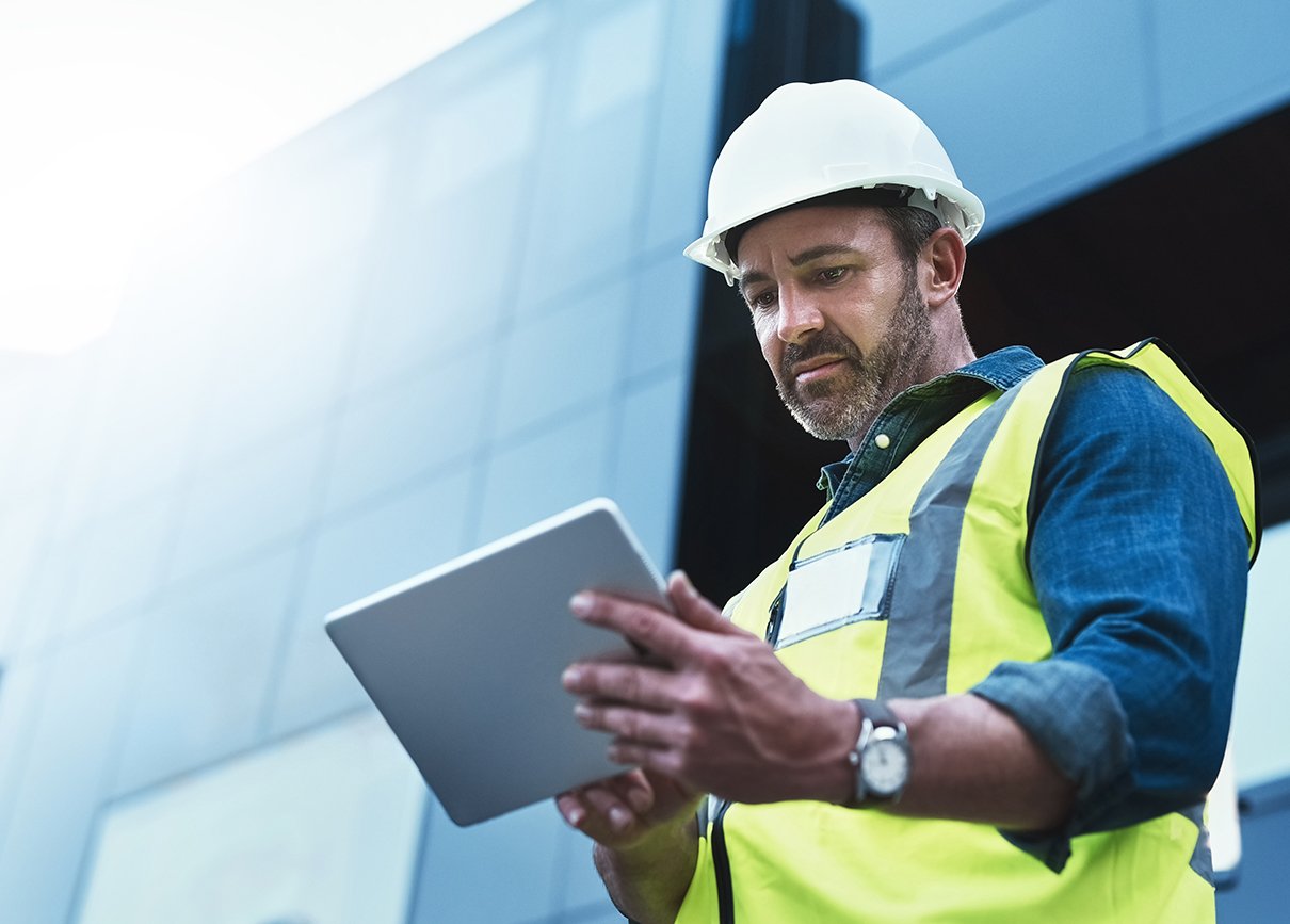 MEP engineer using a digital tablet.
