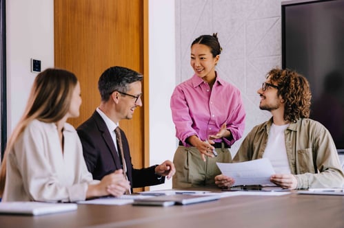 Group of coworkers at table in a meeting room