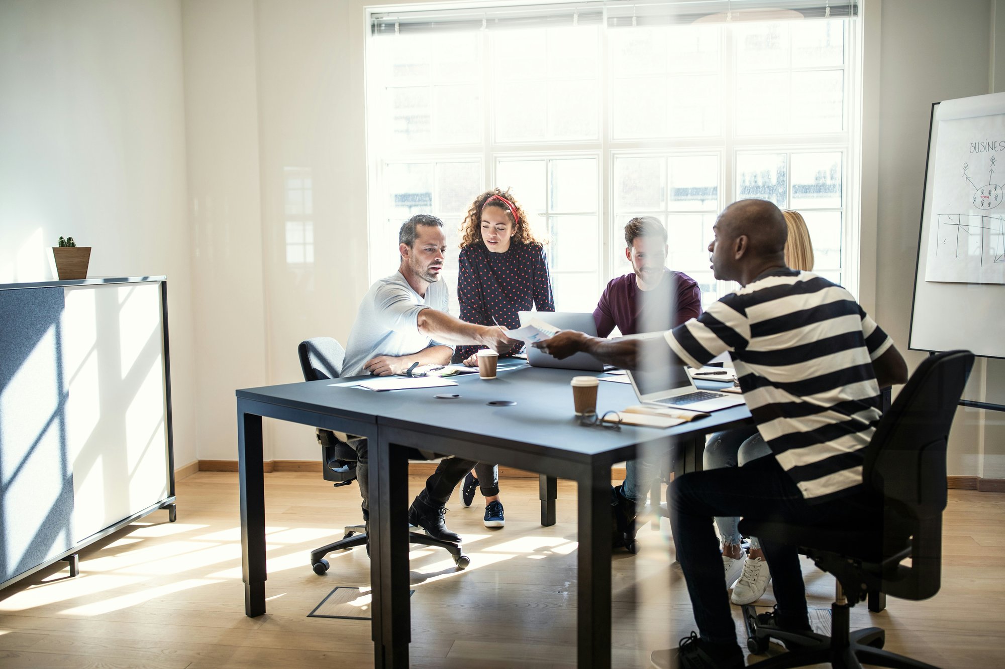 Small group of people working together at a table